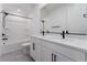 Beautiful bathroom featuring double sinks with a quartz countertop and modern finishes at 8648 Cloverbelle St, Las Vegas, NV 89166