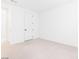 Bright bedroom boasts neutral carpeting, white trim and fresh paint at 8648 Cloverbelle St, Las Vegas, NV 89166