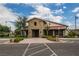 Community clubhouse featuring stone accents, covered entries, ample parking, and meticulous landscaping at 8648 Cloverbelle St, Las Vegas, NV 89166