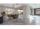 Staged dining room with modern table, chairs, and sliding door access to outdoor space at 8648 Cloverbelle St, Las Vegas, NV 89166