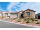 Beautifully landscaped front yard with brick pathway leading to the home's entrance at 8648 Cloverbelle St, Las Vegas, NV 89166
