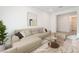 Cozy living room featuring a comfortable sofa, modern art, and stylish coffee table with decor at 8648 Cloverbelle St, Las Vegas, NV 89166
