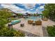 Community pool area with lounge chairs, umbrellas, lush landscaping and ample patio for sunbathing and relaxation at 8648 Cloverbelle St, Las Vegas, NV 89166