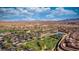 Aerial view showcasing a community with a clubhouse, golf, tennis and beautiful desert landscaping at 906 Majestic Vw, Mesquite, NV 89034