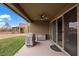 Covered back patio with a ceiling fan, barbecue grill, and sliding glass door access to the home at 906 Majestic Vw, Mesquite, NV 89034