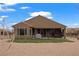 Expansive backyard with gravel, grass, covered patio, barbecue grill, and hot tub at 906 Majestic Vw, Mesquite, NV 89034