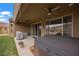 Relaxing patio with a hot tub and covered grill, ideal for outdoor entertaining and enjoying the backyard at 906 Majestic Vw, Mesquite, NV 89034