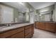 Spacious bathroom with dual vanities, granite countertops, tile floors, and a separate glass-enclosed shower at 906 Majestic Vw, Mesquite, NV 89034