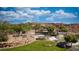 Beautiful landscaped entrance with tiered stone waterfalls and lush greenery welcomes you to the Sun City Mesquite community at 906 Majestic Vw, Mesquite, NV 89034
