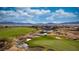 Picturesque golf course view with water features and mountain backdrop on a sunny day at 906 Majestic Vw, Mesquite, NV 89034