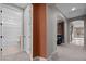 Hallway leading to the bathroom and living spaces with a view to the outside at 906 Majestic Vw, Mesquite, NV 89034