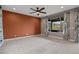 Bright living room showcasing plush carpeting, a ceiling fan, and neutral tones, creating a cozy atmosphere at 906 Majestic Vw, Mesquite, NV 89034