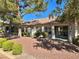 Wide backyard view showing the covered patio area and sliding glass door access at 9369 Villa Ridge Dr, Las Vegas, NV 89134