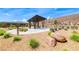 Outdoor picnic and gathering space with desert landscaping at 12397 Foxtail Run Ave, Las Vegas, NV 89138