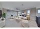 A brightly lit, furnished living room boasts comfortable seating and modern decor at 12397 Foxtail Run Ave, Las Vegas, NV 89138
