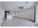 Expansive living area boasts wood-look tile, recessed lighting, and sun-drenched windows at 12397 Foxtail Run Ave, Las Vegas, NV 89138