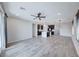 Open concept living room with tile floors, recessed lights, ceiling fan and dark window coverings at 12397 Foxtail Run Ave, Las Vegas, NV 89138