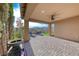Covered patio with brick pavers featuring a fountain and sitting area at 12397 Foxtail Run Ave, Las Vegas, NV 89138