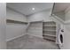 Walk-in closet featuring built-in shelving and hanging rods for optimal storage and organization at 12397 Foxtail Run Ave, Las Vegas, NV 89138