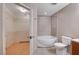 Bathroom boasts a soaking tub with shower and large mirror over a wood vanity at 200 W Sahara Ave # 3009, Las Vegas, NV 89102