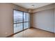Bedroom features hardwood floors and sliding glass doors to the balcony with city views at 200 W Sahara Ave # 3009, Las Vegas, NV 89102