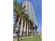 Modern high-rise exterior with lush palm trees and attractive signage at 200 W Sahara Ave # 3009, Las Vegas, NV 89102