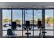 Well-equipped fitness center with views of the pool deck and city skyline at 200 W Sahara Ave # 3009, Las Vegas, NV 89102