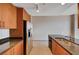Well-designed kitchen with granite countertops, tile flooring and stainless appliances and a stainless refrigerator at 200 W Sahara Ave # 3009, Las Vegas, NV 89102