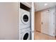 Convenient laundry closet featuring a stacked washer and dryer at 200 W Sahara Ave # 3009, Las Vegas, NV 89102