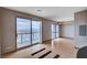 Spacious living room with lots of natural light through large windows, and custom hardwood flooring at 200 W Sahara Ave # 3009, Las Vegas, NV 89102