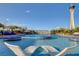 Inviting pool area with unique lounge seating and views of The Strat at 200 W Sahara Ave # 3009, Las Vegas, NV 89102