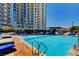 Resort-style pool with numerous lounge chairs and landscaping at 200 W Sahara Ave # 3009, Las Vegas, NV 89102