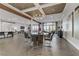 Spacious living room featuring hardwood floors, a modern chandelier, and large windows offering natural light and views at 2080 Orchard Mist St, Las Vegas, NV 89135