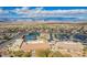 Community aerial view with tennis courts, clubhouse, parking, and surrounding residential homes at 2386 Amana Dr, Henderson, NV 89044