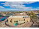 Aerial view showcasing clubhouse with pool and tennis courts, highlighting resort-style living at 2386 Amana Dr, Henderson, NV 89044