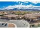Aerial view of the community buildings, landscaping, and parking area at 2386 Amana Dr, Henderson, NV 89044