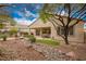 Exterior view of backyard featuring decorative desert landscaping at 2386 Amana Dr, Henderson, NV 89044