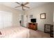 Bright bedroom features neutral carpet, ceiling fan, and closet at 2386 Amana Dr, Henderson, NV 89044