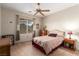 Bedroom features carpet floors, ceiling fan and large window at 2386 Amana Dr, Henderson, NV 89044