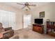 Bedroom with a ceiling fan, closet, and dresser with television at 2386 Amana Dr, Henderson, NV 89044