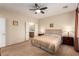 This bedroom features carpet floors, a ceiling fan and a standard closet at 2386 Amana Dr, Henderson, NV 89044