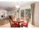 Cozy breakfast nook with backyard views and seating for four, bathed in natural light at 2386 Amana Dr, Henderson, NV 89044