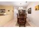 Inviting dining area with a wooden table, seating for six, and neutral color scheme at 2386 Amana Dr, Henderson, NV 89044
