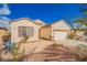 Inviting single-story home with desert landscaping, a cozy bench, and a neatly paved walkway to the entrance at 2386 Amana Dr, Henderson, NV 89044