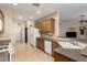 Functional kitchen featuring ample counter space, wooden cabinets, and stainless steel sink at 2386 Amana Dr, Henderson, NV 89044