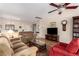 Open living room with tile flooring, comfortable seating, and an open view to the dining area at 2386 Amana Dr, Henderson, NV 89044