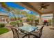 Covered patio with outdoor dining table and ceiling fan at 2386 Amana Dr, Henderson, NV 89044