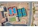 A high angle shows tennis courts of varied colors, bocce ball, and manicured landscaping at 2386 Amana Dr, Henderson, NV 89044
