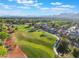 Panoramic aerial view showcasing the golf course with beautiful homes and mountain views at 2553 Showcase Dr, Las Vegas, NV 89134