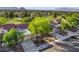 Beautiful aerial view of homes surrounded by lush landscaping and a golf course at 2553 Showcase Dr, Las Vegas, NV 89134